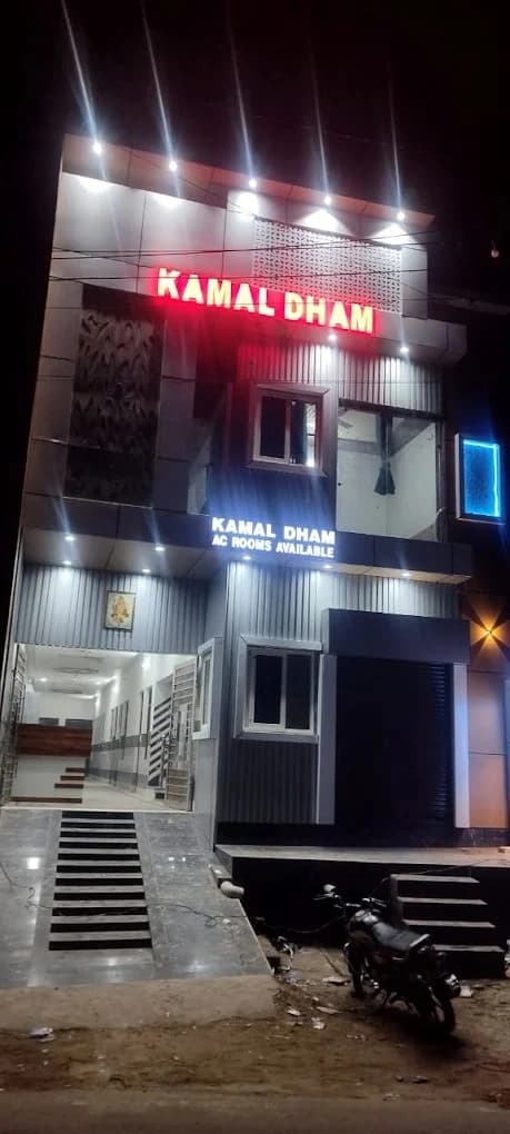 Hotel Kamal Dham exterior at night